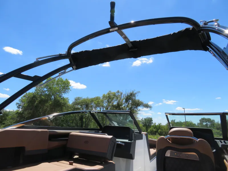 Slide: The Image of 2024 Cobalt R4 boat interior with sleek design and comfortable seating under a clear blue sky. - 15