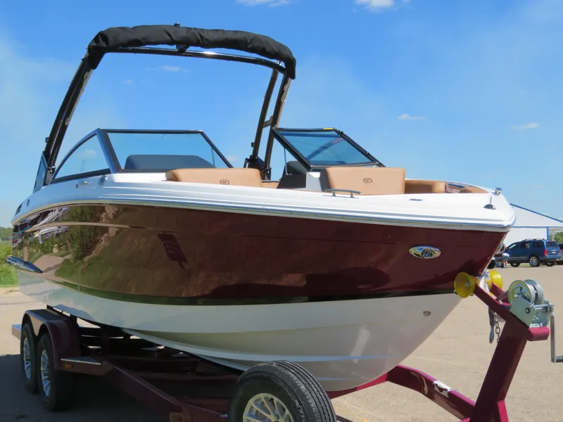 Slide: The Image of 2024 Cobalt R4 boat on trailer, sleek design, sunny day. - 3