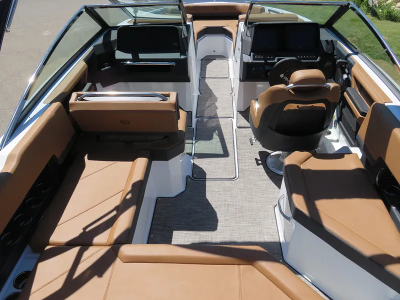 Slide: The Image of 2024 Cobalt R4 boat interior with luxurious tan seating and modern dashboard. - 4