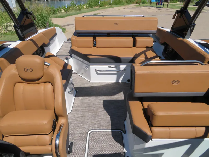 Slide: The Image of 2024 Cobalt R4 boat interior with tan leather seating and spacious layout. - 5