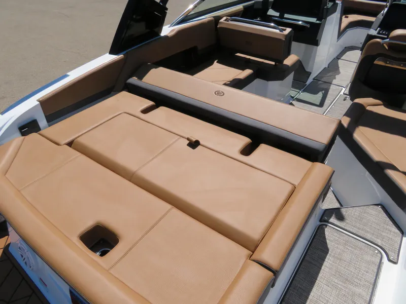Slide: The Image of 2024 Cobalt R4 boat interior with tan leather seating and modern design. - 7