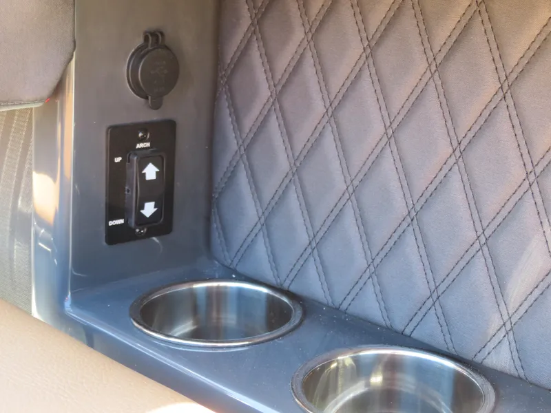 Slide: The Image of 2024 Cobalt R4 interior with quilted panel, cup holders, and control switches. - 8