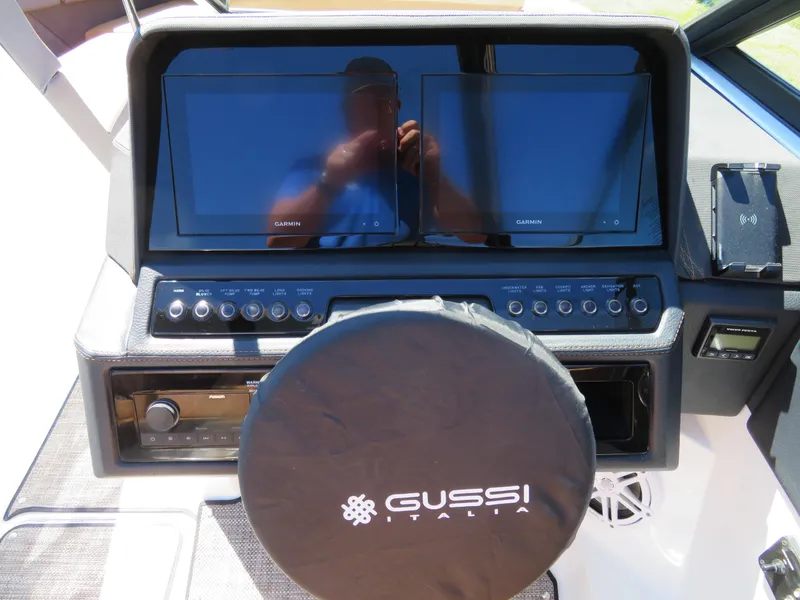 Slide: The Image of 2024 Cobalt R4 boat dashboard with dual screens and Gussi Italia steering wheel cover. - 9
