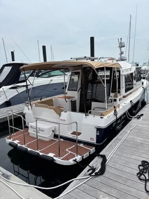 Slide: The Image of 2023 Ranger Tugs R-29 S docked at marina, rear view. - 4