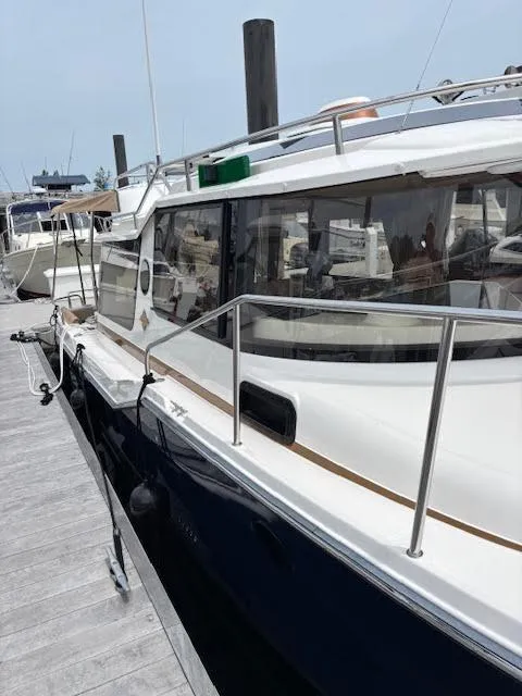 Slide: The Image of 2023 Ranger Tugs R-29 S docked, showcasing sleek design and modern features. - 5