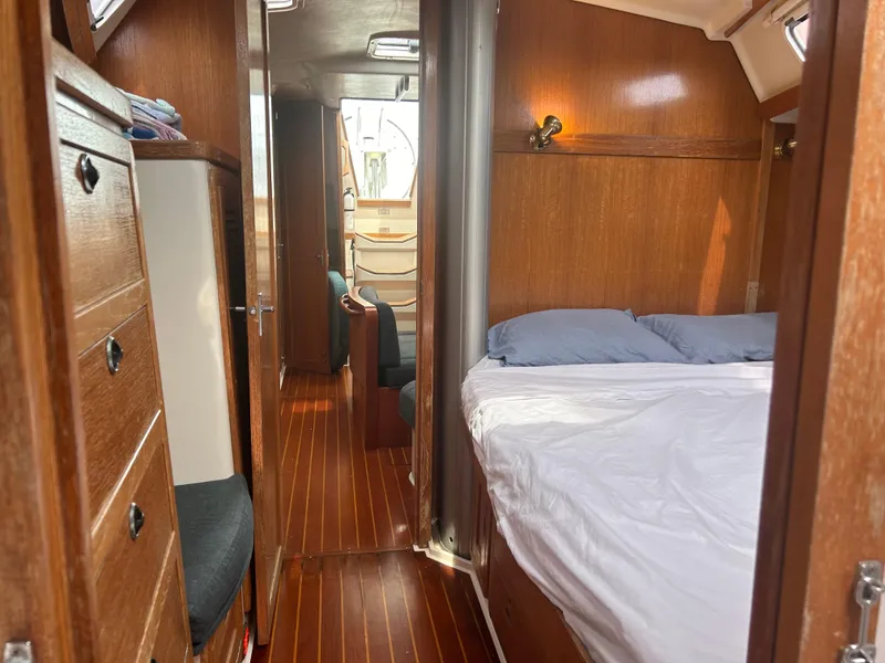 Slide: The Image of Interior of 1998 Catalina 42 MkII sailboat with wood paneling and cozy sleeping area. - 18