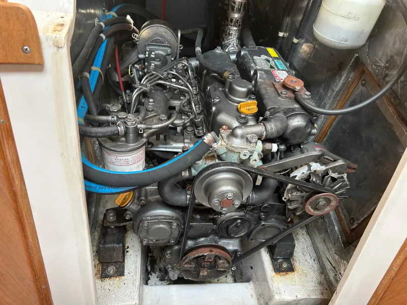 Slide: The Image of Engine compartment of a 1998 Catalina 42 MkII sailboat, showcasing mechanical components. - 24