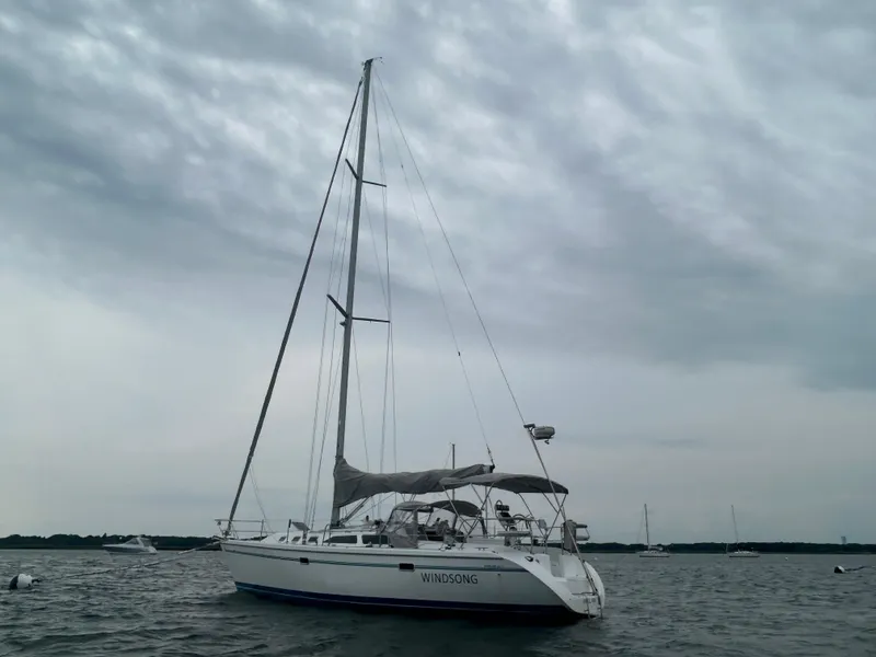 Slide: The Image of Sailboat Catalina 42 MkII 1998 on calm waters under cloudy sky. - 3