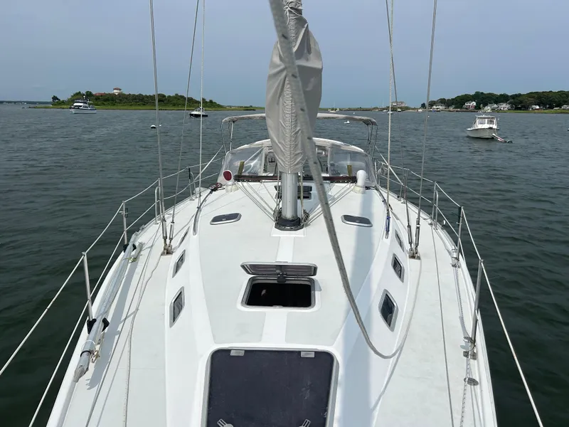 Slide: The Image of Catalina 42 MkII sailboat deck view, anchored in calm waters, 1998 model. - 5