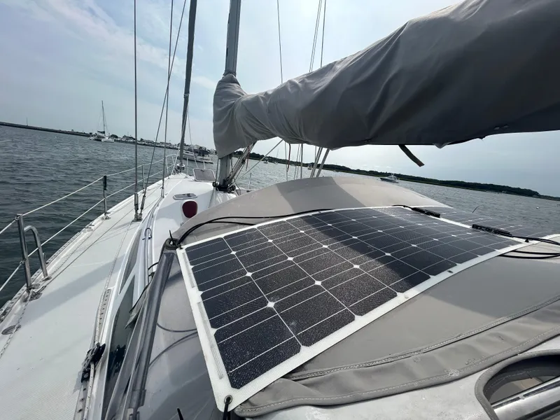Slide: The Image of Catalina 42 MkII sailboat with solar panels on deck, 1998 model, sailing on open water. - 6