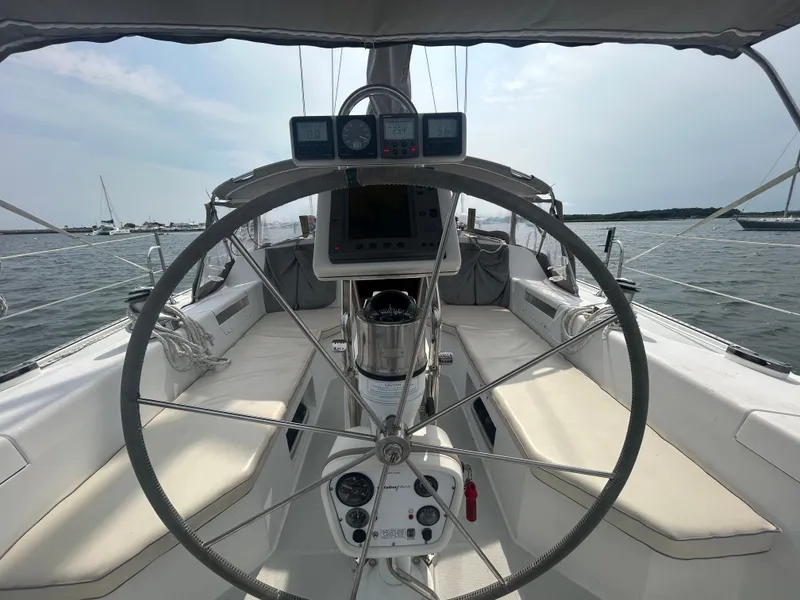 Slide: The Image of Cockpit of 1998 Catalina 42 MkII sailboat with steering wheel and navigation instruments. - 9