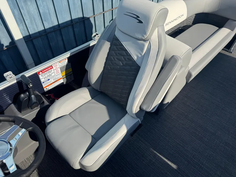 Slide: The Image of 2025 Bennington 22 SSRSR boat seat with gray upholstery and sleek design. - 13