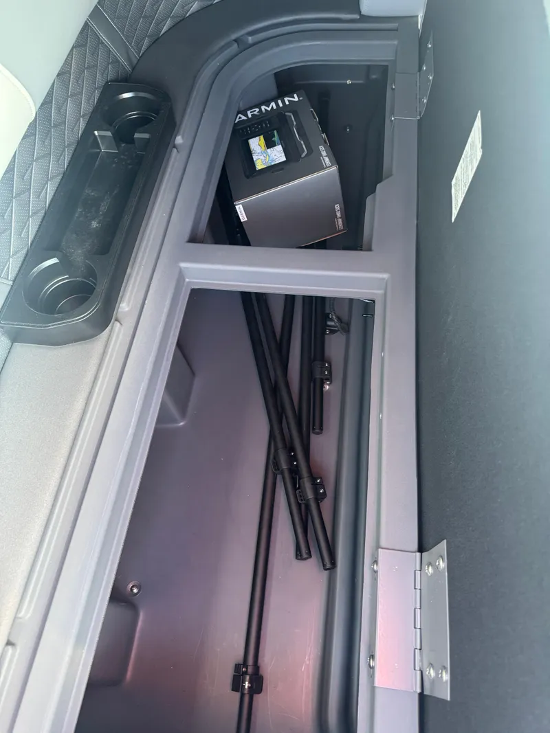 Slide: The Image of Storage compartment in 2025 Bennington 22 SSRSR boat with Garmin box and rods. - 19