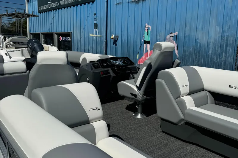 Slide: The Image of 2025 Bennington 22 SSRSR pontoon boat interior with gray and white seating. - 2