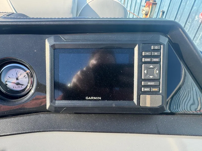 Slide: The Image of Garmin display and fuel gauge on 2025 Bennington 22 SSRSR boat dashboard. - 5