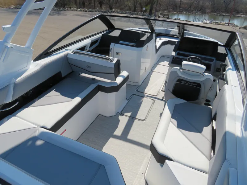 Slide: The Image of 2024 Cobalt R6 Surf boat interior with sleek seating and modern design. - 13