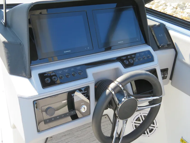 Slide: The Image of 2024 Cobalt R6 Surf dashboard with dual screens and modern controls. - 14