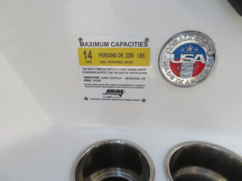 Slide: The Image of 2024 Cobalt R6 Surf capacity label, 14 persons or 2285 lbs, USA made emblem. - 15