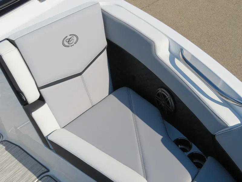 Slide: The Image of 2024 Cobalt R6 Surf boat interior with sleek gray seating and cup holders. - 16