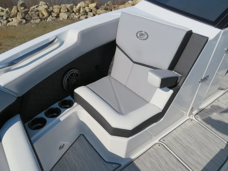 Slide: The Image of 2024 Cobalt R6 Surf boat interior with cushioned seating and cup holders. - 18