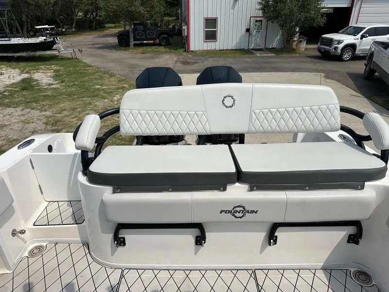 Slide: The Image of 2021 Fountain 34TE boat with cushioned seating and diamond-patterned upholstery. - 15