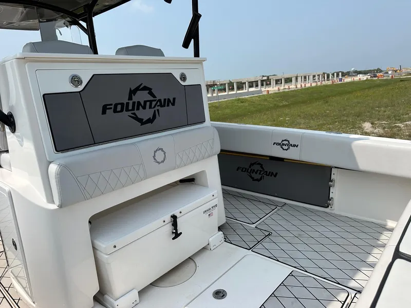 Slide: The Image of 2021 Fountain 34TE boat interior with branded seating and storage compartments. - 16