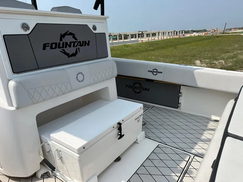 Slide: The Image of 2021 Fountain 34TE boat interior with seating and storage, featuring sleek design and branding. - 17