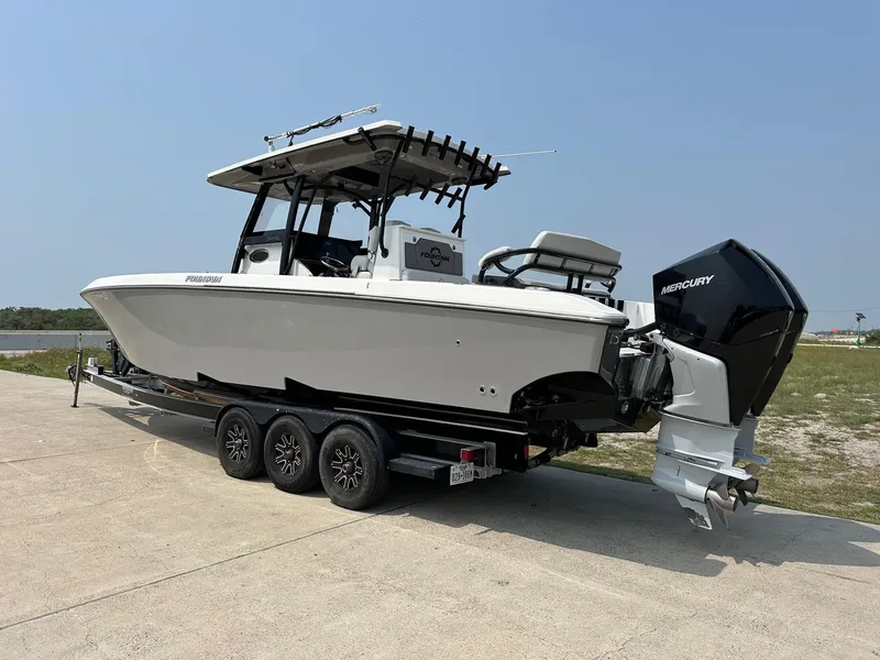 Slide: The Image of 2021 Fountain 34TE boat on trailer with Mercury outboard engine. - 3