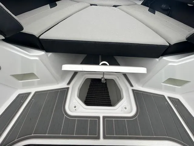 Slide: The Image of 2025 Monterey 27 Elite boat interior with cushioned seating and non-slip flooring. - 11