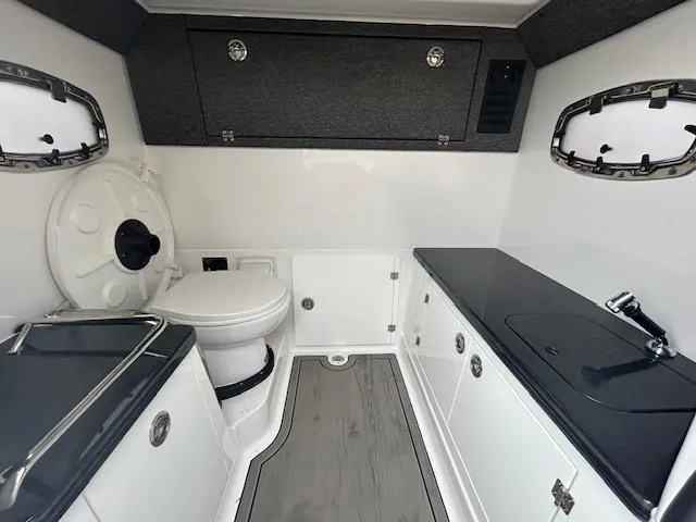Slide: The Image of 2025 Monterey 27 Elite boat interior with modern bathroom amenities. - 12