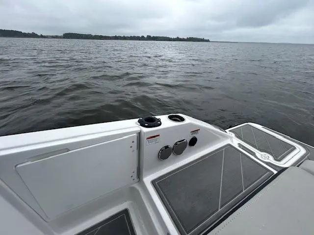 Slide: The Image of 2025 Monterey 27 Elite boat on calm waters, featuring sleek deck design. - 14