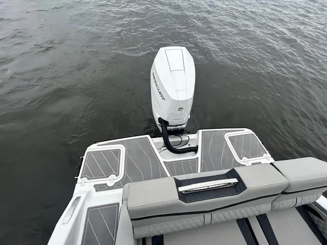 Slide: The Image of 2025 Monterey 27 Elite boat with Mercury outboard engine on water. - 15