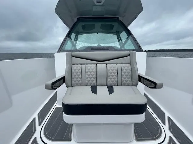 Slide: The Image of 2025 Monterey 27 Elite boat interior with cushioned seating and modern design. - 18