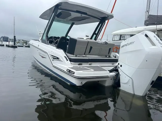 Slide: The Image of 2025 Monterey 27 Elite boat with Mercury engine docked in marina. - 2