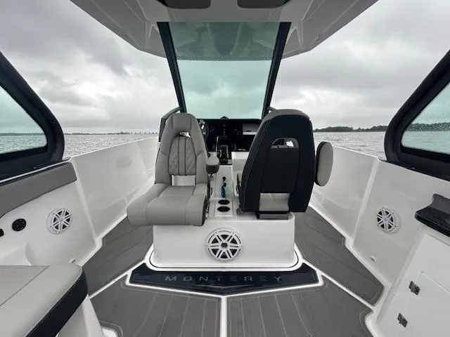 Slide: The Image of 2025 Monterey 27 Elite boat interior with modern seating and sleek design. - 6