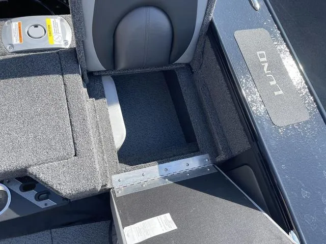 Slide: The Image of 2025 Lund 2075 Pro-V Sport boat interior with storage compartment and seating. - 10