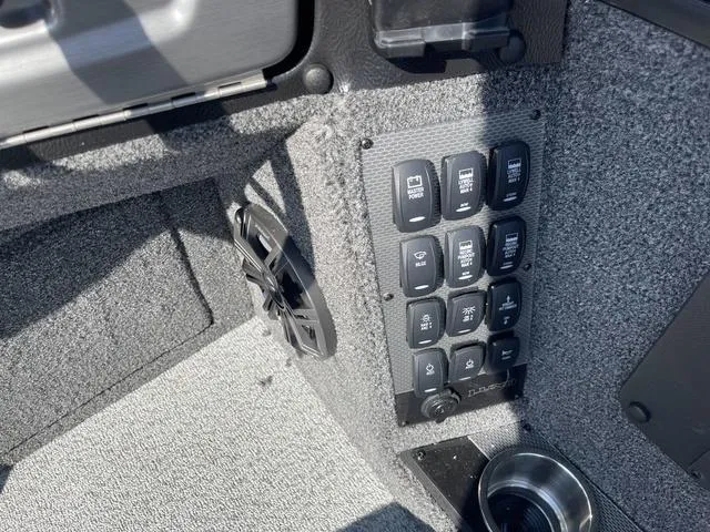 Slide: The Image of Control panel and speaker in 2025 Lund 2075 Pro-V Sport boat interior. - 26