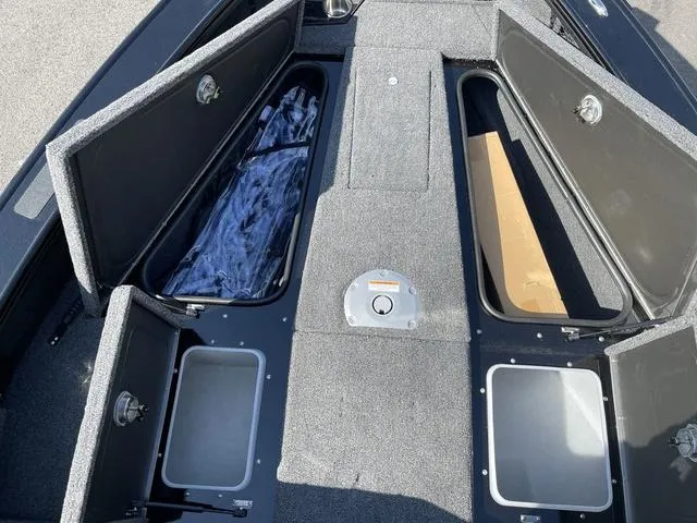 Slide: The Image of 2025 Lund 2075 Pro-V Sport boat storage compartments open, showcasing spacious interior design. - 38