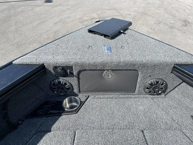 Slide: The Image of 2025 Lund 2075 Pro-V Sport boat interior with speakers and cup holder. - 39