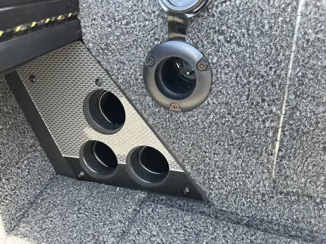 Slide: The Image of 2025 Lund 2075 Pro-V Sport interior detail with cup holders and textured panel. - 41