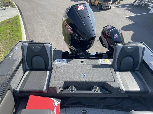 Slide: The Image of 2025 Lund 2075 Pro-V Sport boat interior with dual Mercury engines. - 8