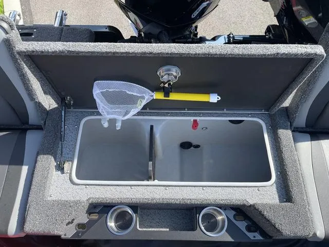Slide: The Image of 2025 Lund 2075 Pro-V Sport boat livewell with fishing net and cup holders. - 9