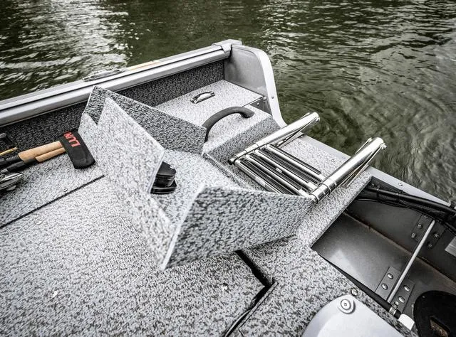 Slide: The Image of 2025 Lund 1775 Impact XS Sport boat interior with ladder and fishing gear. - 12