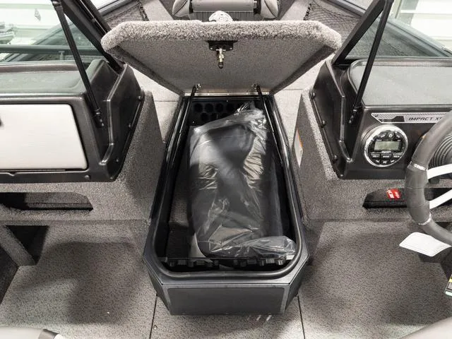 Slide: The Image of 2025 Lund 1875 Impact XS boat interior storage compartment open, showcasing spacious design. - 14