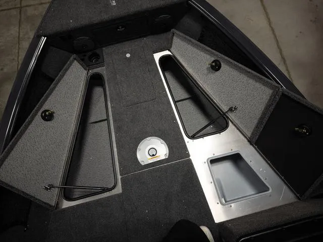 Slide: The Image of 2025 Lund 1875 Impact XS boat interior with open storage compartments. - 16