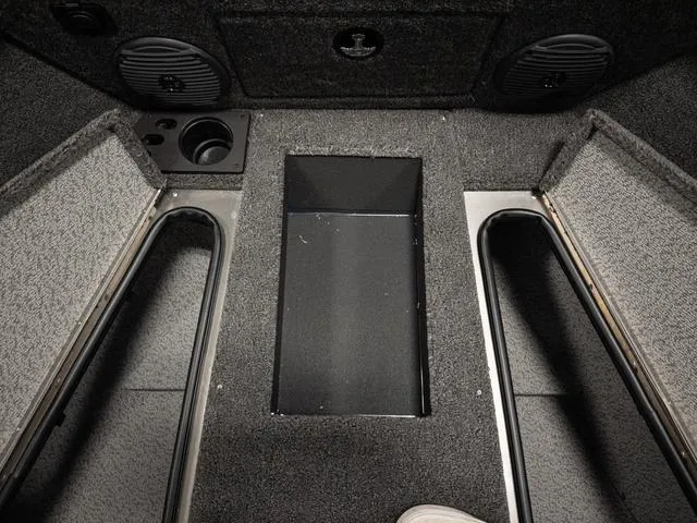 Slide: The Image of Interior of 2025 Lund 1875 Impact XS boat, featuring storage compartments and speakers. - 17