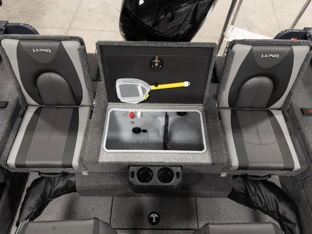 Slide: The Image of 2025 Lund 1875 Impact XS boat interior with organized storage compartments and seating. - 4