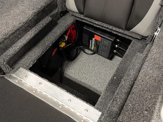 Slide: The Image of 2025 Lund 1875 Impact XS boat dashboard with control panel and speaker. - 5