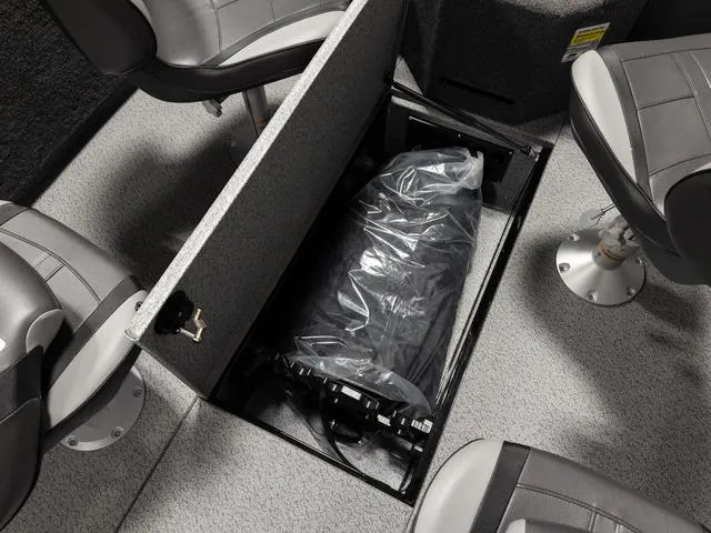 Slide: The Image of 2025 Lund 2075 Fisherman Sport boat interior storage compartment with seats. - 11