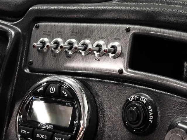 Slide: The Image of Control panel of 2025 Lund 2075 Fisherman Sport boat with switches and audio system. - 15